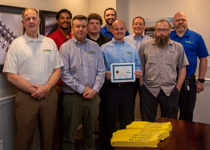 Our team members take a group photo after earning the Lean 6 Sigma Yellow Belt 