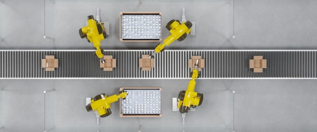 An overhead view of 4 robot picking machines on an assembly line