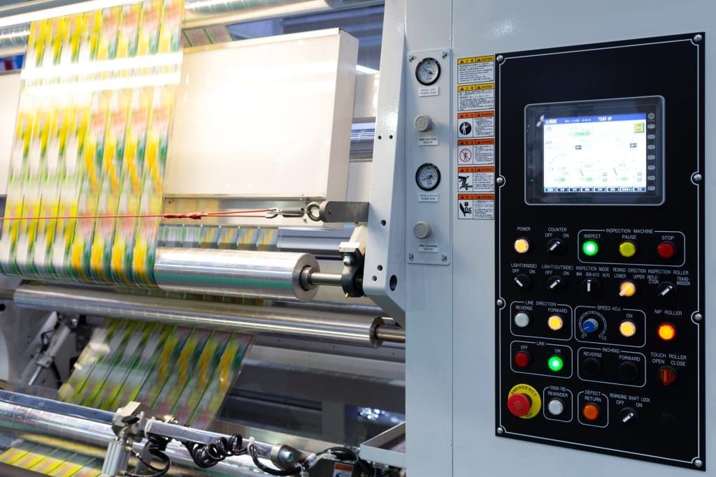 a sizeable thermal transfer overprinter with a length of plastic packaging winding through its rollers