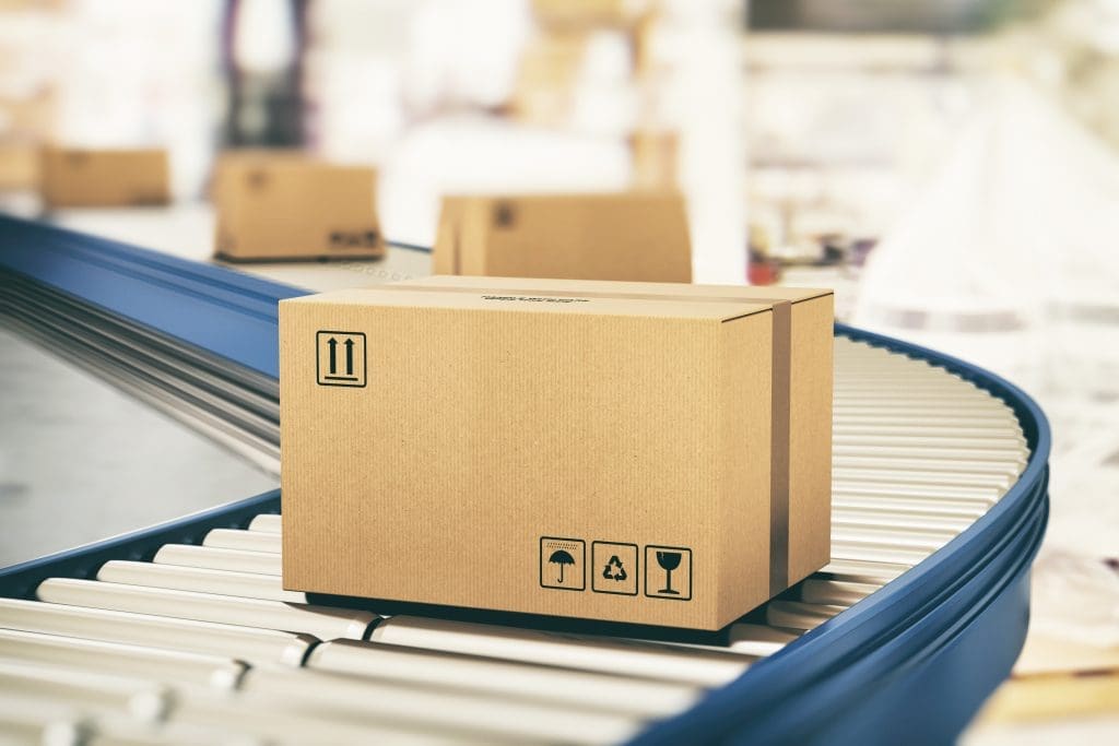 Cardboard boxes on a conveyor belt.